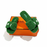 Sandali Oran in pelle shearling Hermès - Verde