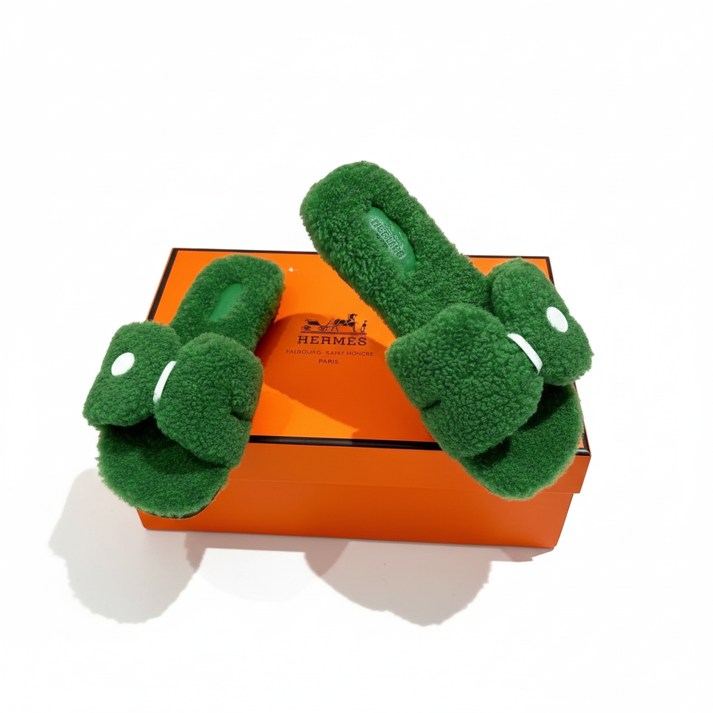 Sandali Oran in pelle shearling Hermès - Verde